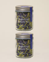 Single Origin Butterfly Pea herbal tea jars showcasing vibrant blue-violet dried flowers.
