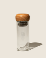 Paradise Double Wall Glass Bottle with a wooden lid designed for sustainability and repeated use.