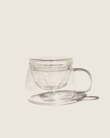 Dewdrop Cup made from high-quality glass with removable strainer and lid for enjoying flower teas.