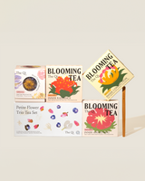 Blooming Tea Ritual Set featuring colorful flower tea boxes and artistic packaging for a calming tea experience.