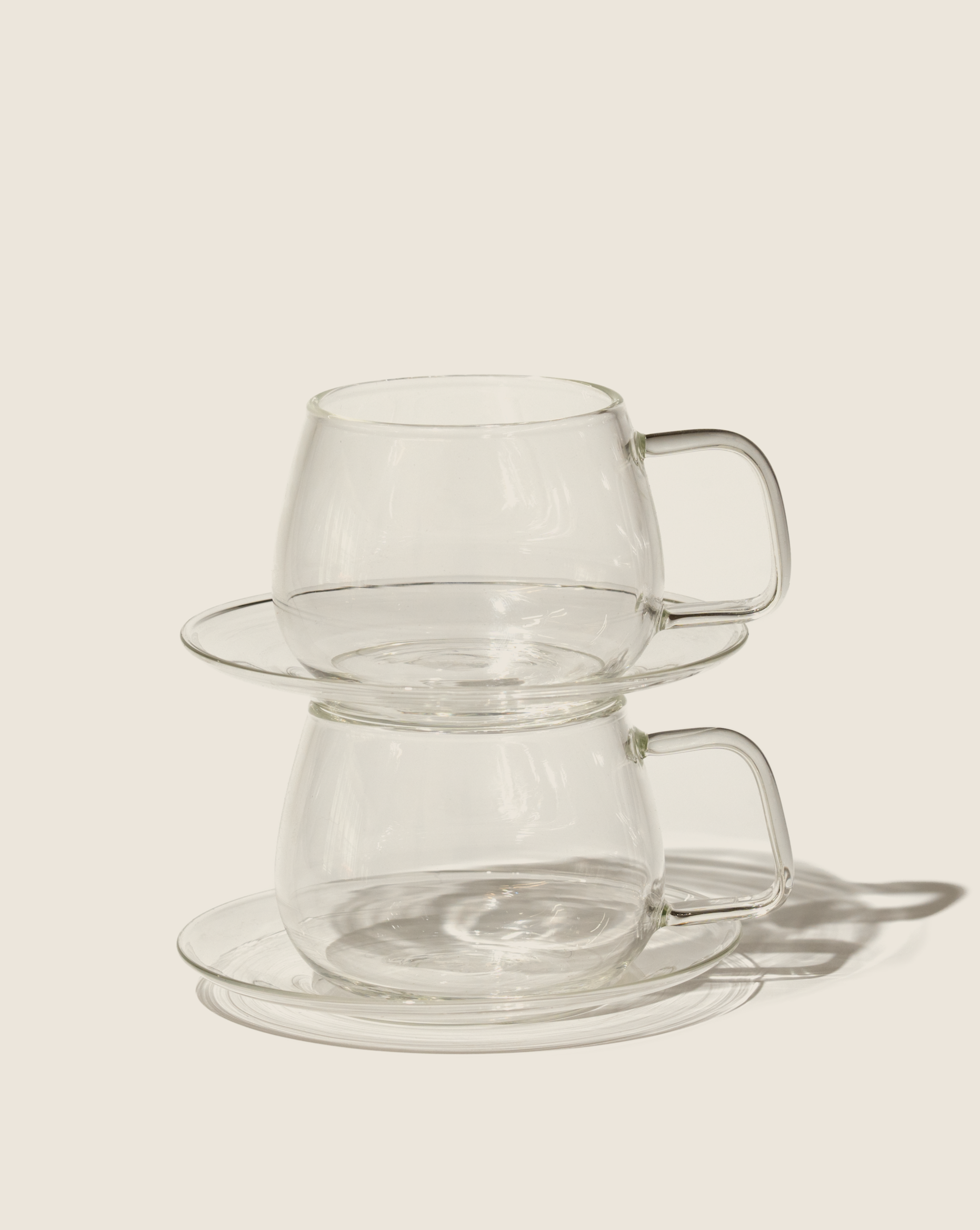 Glass cups + saucers (set of 2)