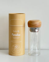Paradise Double Wall Glass Bottle with natural wood lid and packaging.