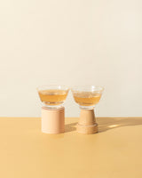 Gold rim glass cups (2) showcasing hand-painted rims, perfect for sipping rituals, with stylish bases.