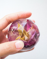 Shangri-la Rose! hand-held floral resin ball with pink and yellow rose petals encased in crystal.