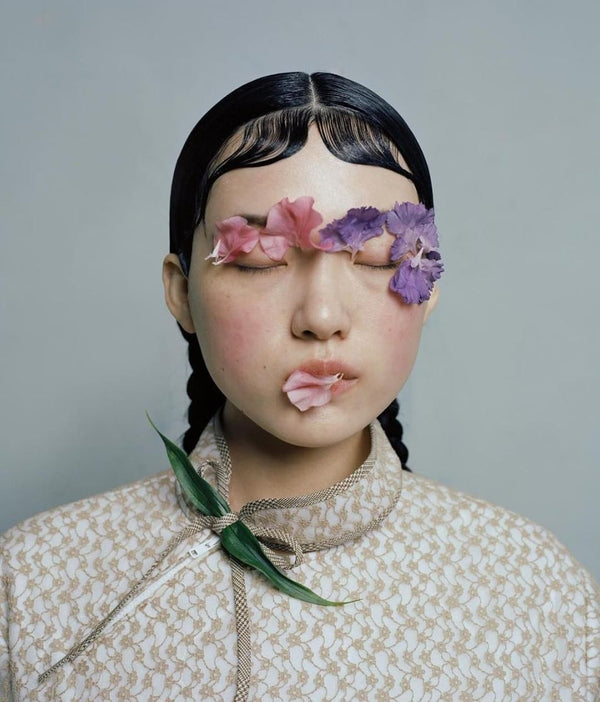 Girl with Flower Petals on Her Face