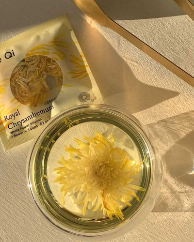 Lunar New Year 2025: The Year of the Wood Snake with chrysanthemum tea and packaging on a table.