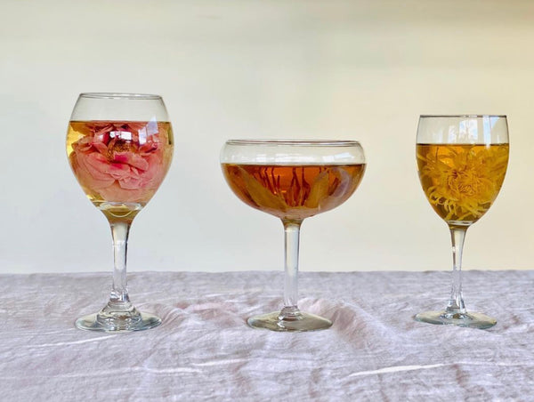 Wine glasses with rose, lotus, and chrysanthemum flower teas