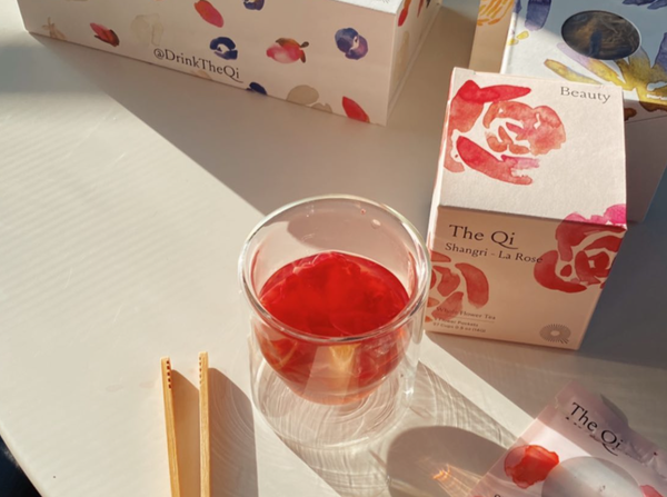 The best 6 sleep teas to try today, featuring Shangri-La Rose tea in a glass with chopsticks.