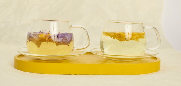 whole blue lotus tea and royal chrysanthemum tea in glass teacups