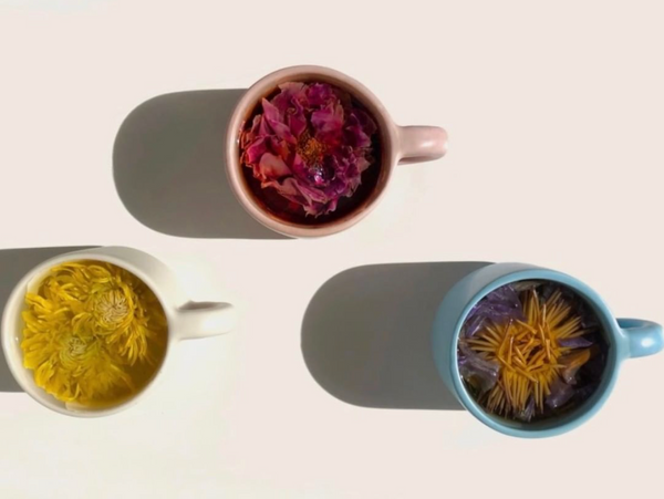 Three mugs of various flower teas