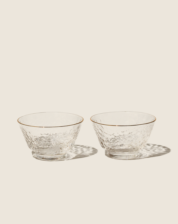 Small sipping glass cup with gold rim