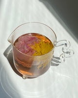 rose and chrysanthemum tea in bloom teapot